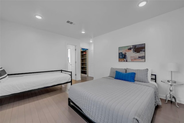 bedroom featuring recessed lighting, visible vents, and wood finished floors