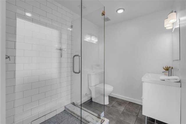 bathroom featuring vanity, tile patterned floors, and a stall shower