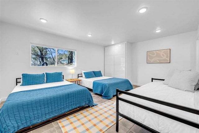 bedroom with recessed lighting and baseboards