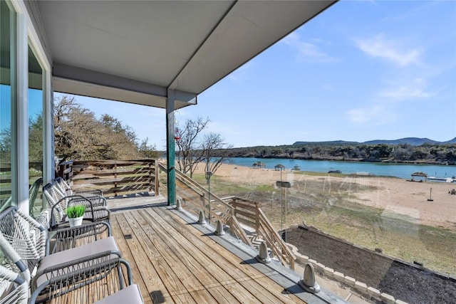 wooden deck with a water view