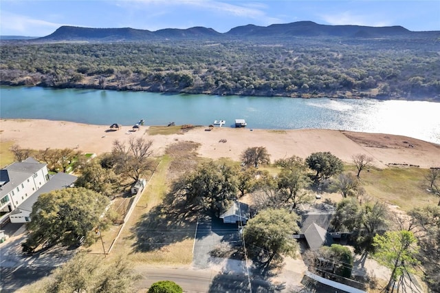 birds eye view of property featuring a water and mountain view