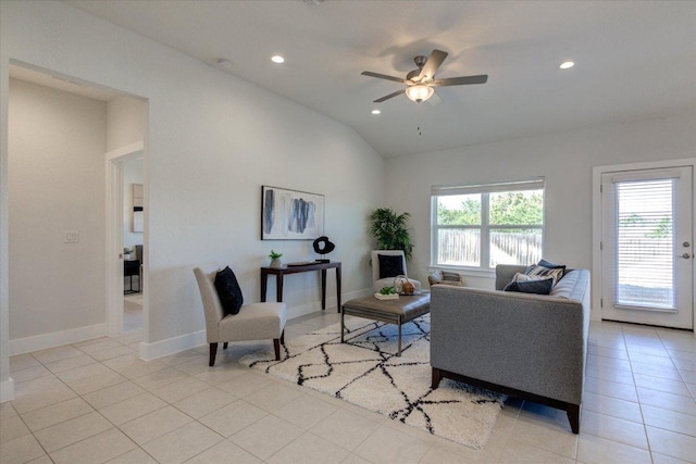 living area with baseboards, ceiling fan, vaulted ceiling, light tile patterned floors, and recessed lighting