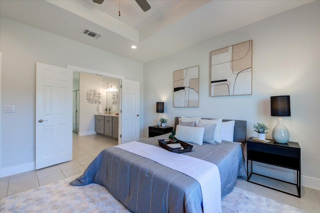 bedroom featuring light tile patterned floors, visible vents, baseboards, recessed lighting, and ensuite bathroom