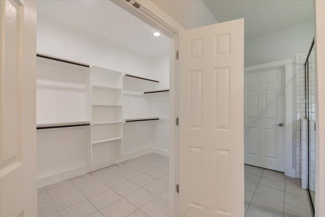 walk in closet featuring light tile patterned floors