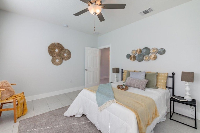 bedroom with tile patterned floors, visible vents, baseboards, and ceiling fan