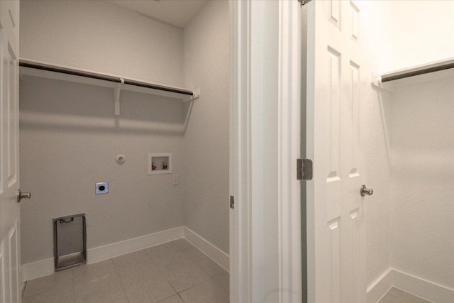 washroom with laundry area, light tile patterned flooring, electric dryer hookup, washer hookup, and hookup for a gas dryer