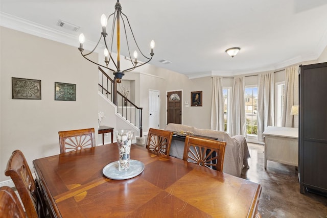 dining room with visible vents, a notable chandelier, ornamental molding, finished concrete floors, and stairway