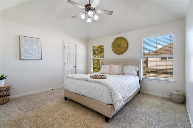 bedroom with baseboards, carpet floors, lofted ceiling, and ceiling fan