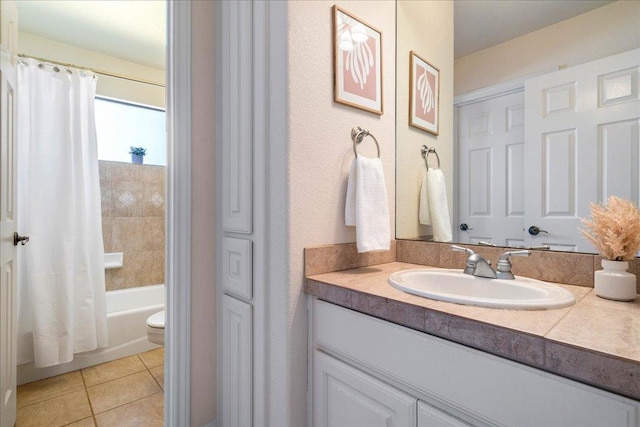 bathroom featuring vanity, tile patterned floors, toilet, and shower / bathtub combination with curtain