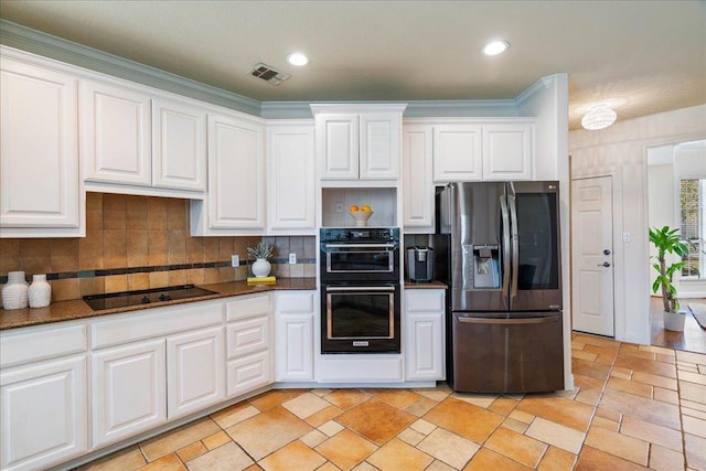 kitchen with visible vents, black appliances, tasteful backsplash, white cabinetry, and recessed lighting