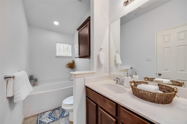 full bathroom featuring a garden tub, toilet, recessed lighting, tile patterned flooring, and vanity