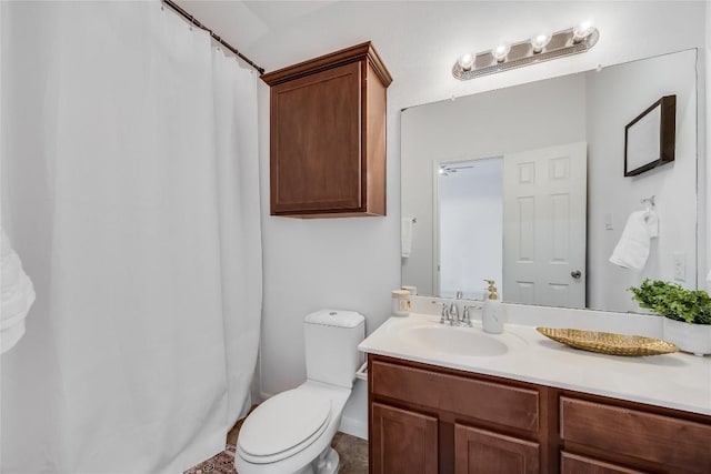 full bathroom with toilet and vanity