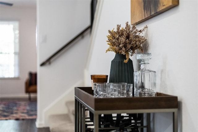 interior details with baseboards and wood finished floors