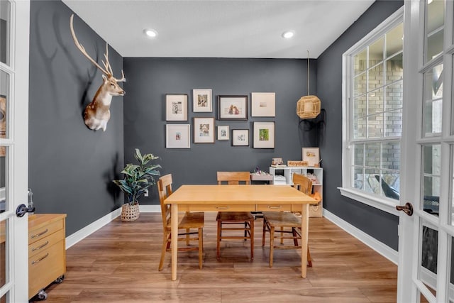 dining area featuring recessed lighting, french doors, baseboards, and wood finished floors