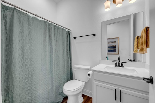 full bathroom with a shower with shower curtain, toilet, wood finished floors, and vanity