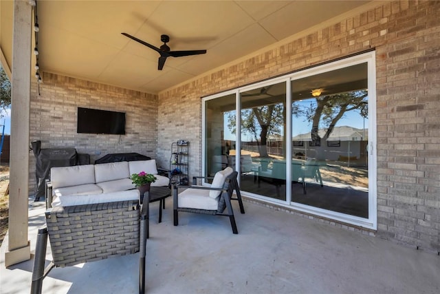 view of patio / terrace with an outdoor hangout area and a ceiling fan