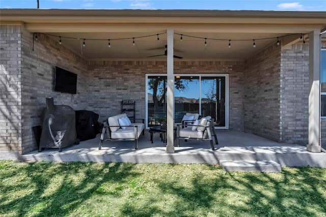 view of patio / terrace featuring area for grilling and ceiling fan