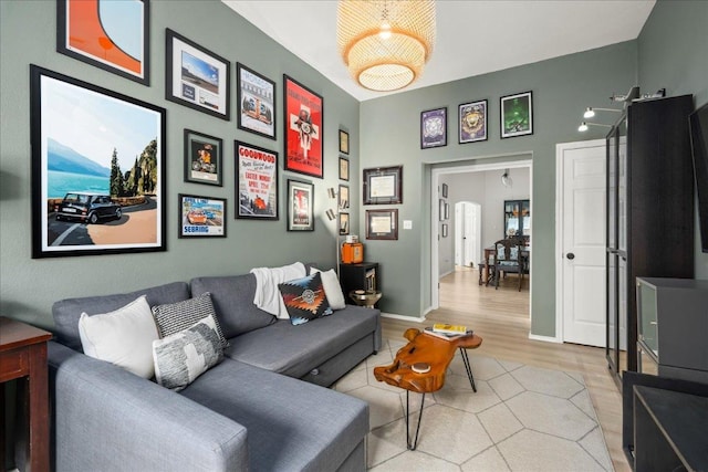 living area with wood finished floors and baseboards