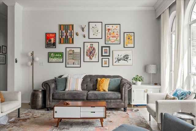 living room featuring light wood-style floors and crown molding