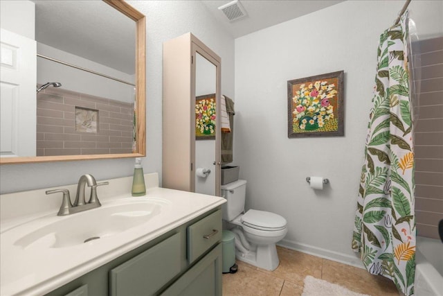 bathroom featuring visible vents, toilet, vanity, and tile patterned flooring