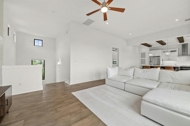 223 Honey Creek Ct Unit 12, Lakeway, TX 78738 - living room with ceiling fan, wood finished floors, recessed lighting, and beam ceiling