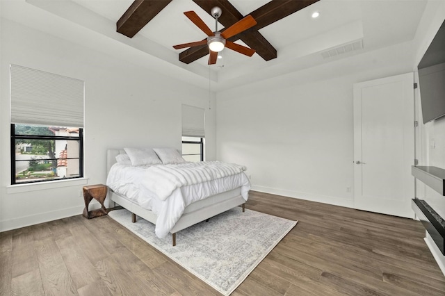 223 Honey Creek Ct Unit 12, Lakeway, TX 78738 - bedroom featuring wood finished floors, beam ceiling, recessed lighting, and ceiling fan