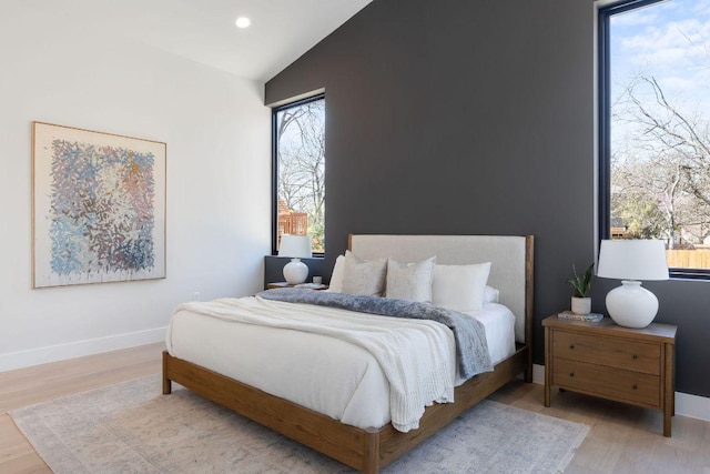 5514 Montview St, Austin, TX 78756 - bedroom with vaulted ceiling, wood finished floors, recessed lighting, and baseboards