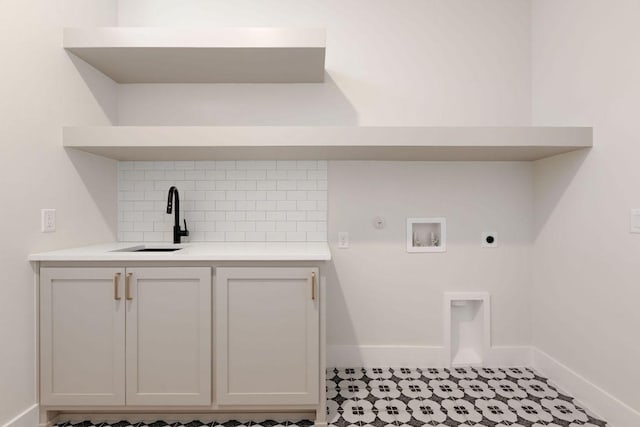 5514 Montview St, Austin, TX 78756 - laundry room with cabinet space, baseboards, electric dryer hookup, and washer hookup