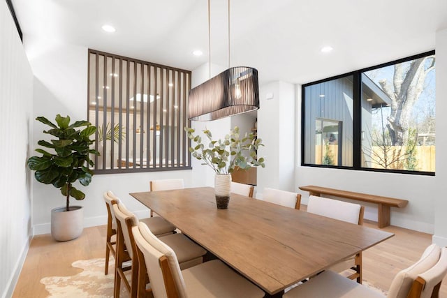 dining space featuring recessed lighting, baseboards, and light wood-style flooring