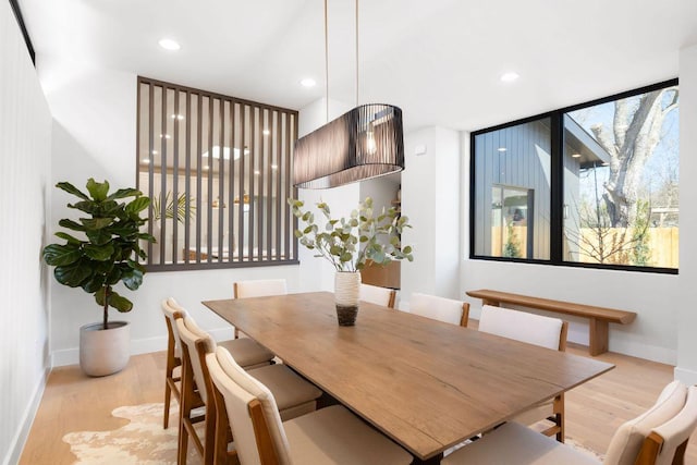 5514 Montview St, Austin, TX 78756 - dining area featuring light wood finished floors, recessed lighting, and baseboards
