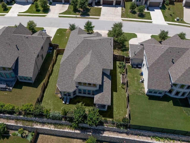 birds eye view of property with a residential view