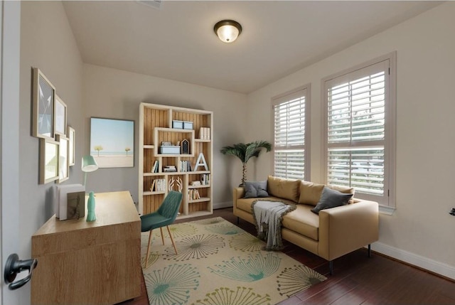 office area with baseboards and wood finished floors