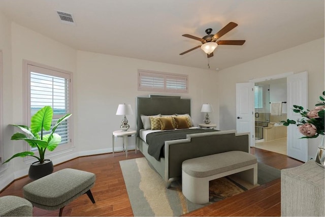 bedroom featuring visible vents, wood finished floors, baseboards, and ceiling fan