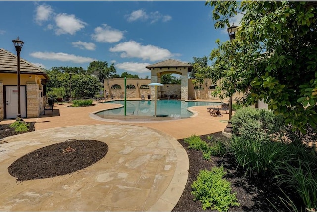 pool with a patio area