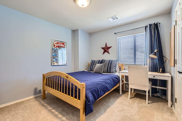 carpeted bedroom with baseboards and visible vents