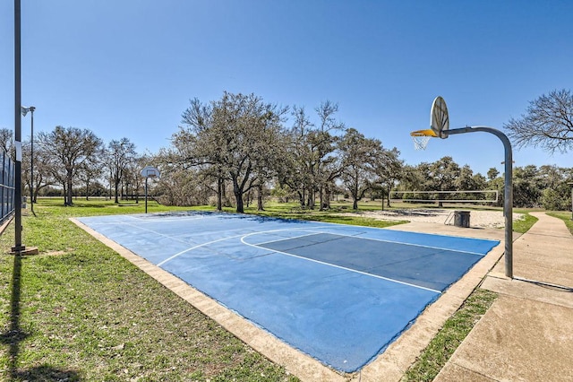 view of sport court with community basketball court, a lawn, and volleyball court