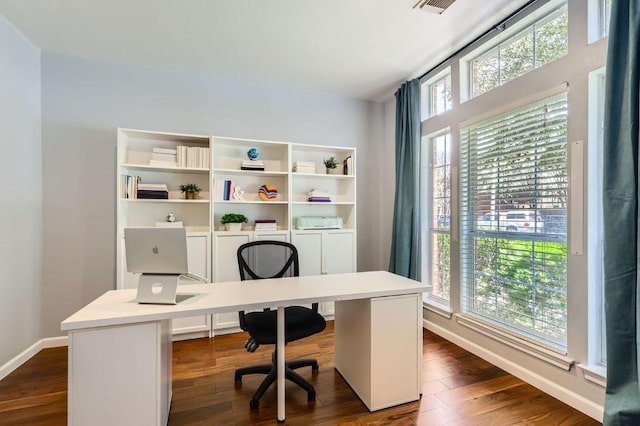 home office featuring dark wood-style floors and baseboards