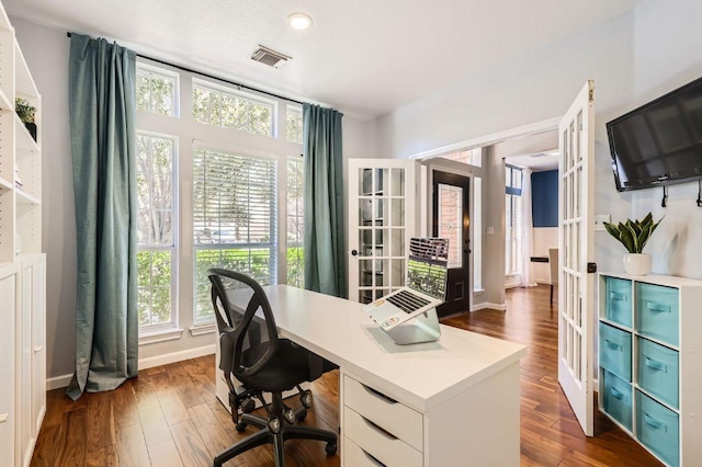 office featuring french doors, visible vents, dark wood-style flooring, and baseboards