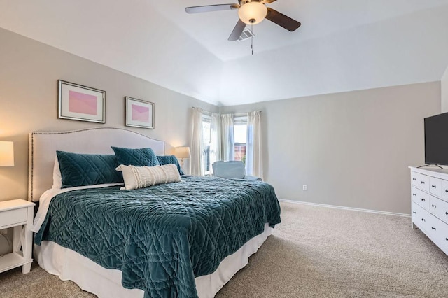 bedroom featuring visible vents, baseboards, vaulted ceiling, carpet floors, and a ceiling fan