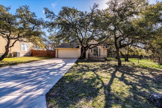 view of front of property featuring a garage, cooling unit, concrete driveway, and fence