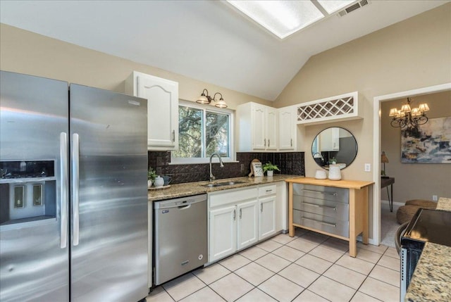 kitchen featuring visible vents, white cabinets, appliances with stainless steel finishes, and a sink