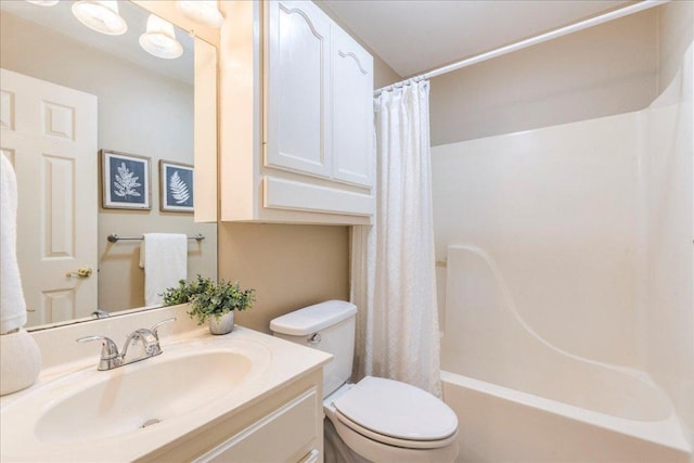 bathroom with toilet, vanity, and shower / bath combination with curtain