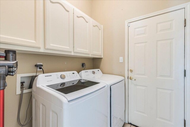 laundry area featuring cabinet space and independent washer and dryer