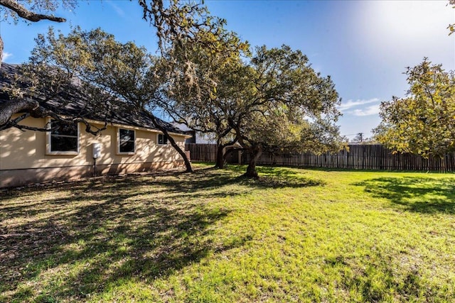 view of yard with a fenced backyard