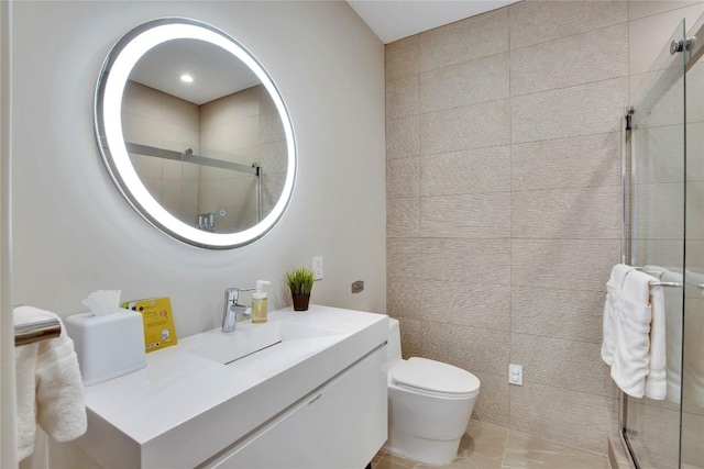 full bath featuring vanity, toilet, and a shower stall