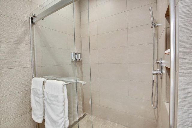 bathroom with a shower stall