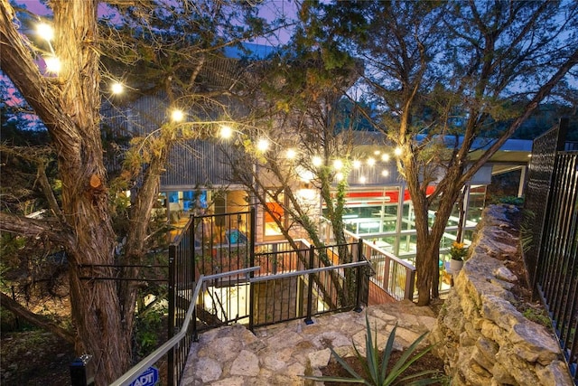 view of back of house at night