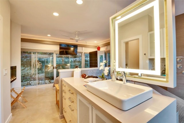 bathroom with recessed lighting, vanity, and a ceiling fan