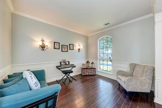 sitting room featuring visible vents, a wainscoted wall, dark wood-style floors, and crown molding