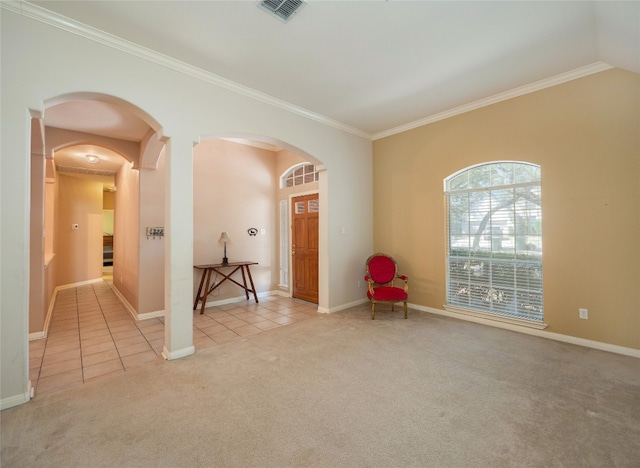 interior space with visible vents, light carpet, arched walkways, crown molding, and light tile patterned floors